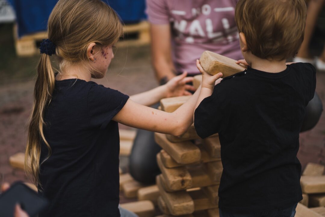 Children Put A Pyramid Of Cubes