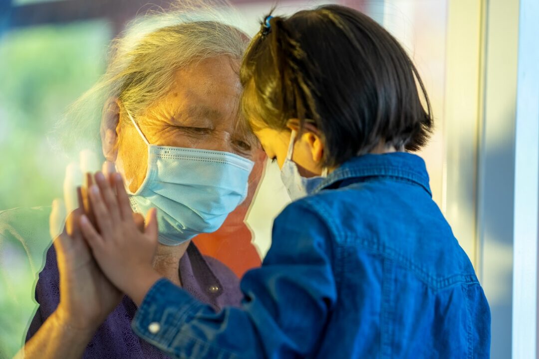 Hand Of The Grandma And Grandchild On A Window Plane,Protection