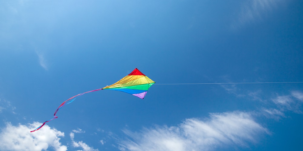 Kite Flying In The Sky Among The Clouds