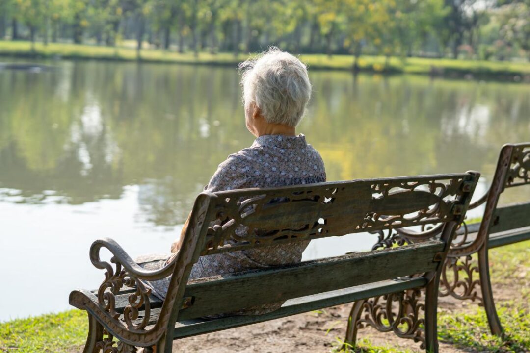 Asian Elderly Woman Depressed Sad Sitting Back Bench Autumn Park