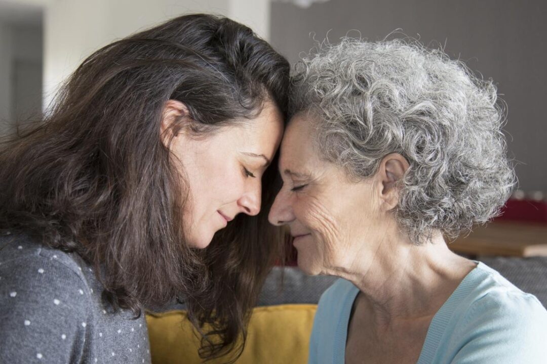 Calm Senior Mother And Daughter Supporting Each Other