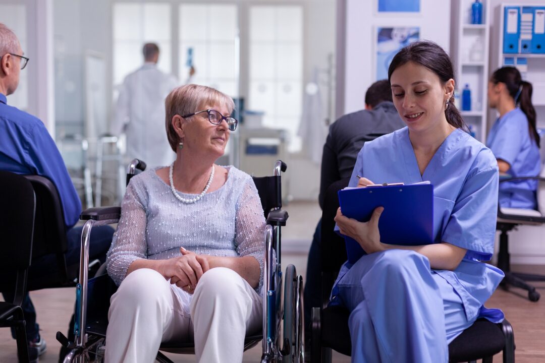 Assistant Taking Notes On Clipboard About Patient Madical Problems