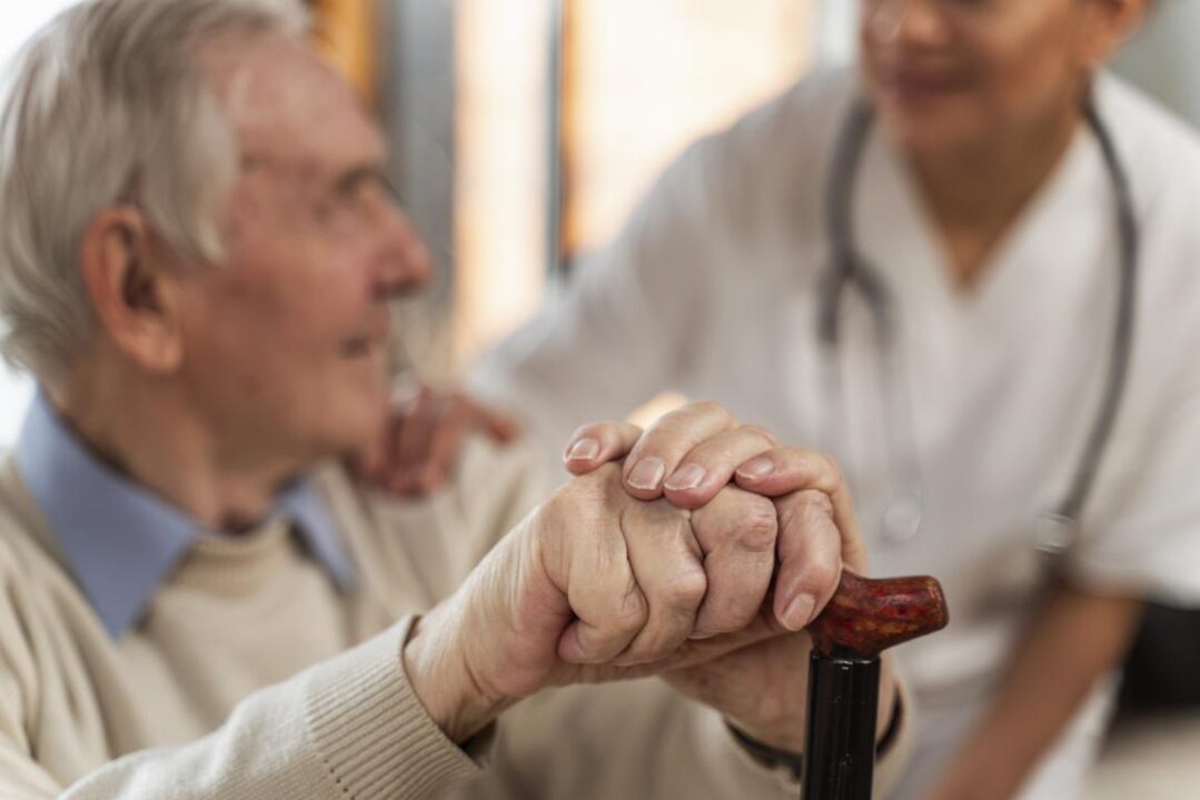 Casual Senior Man Home With Doctor 2