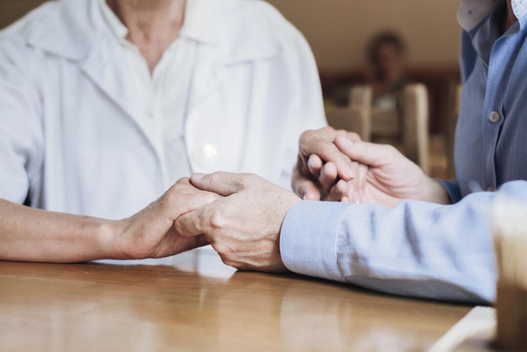 Close Up Old People Holding Hands 1