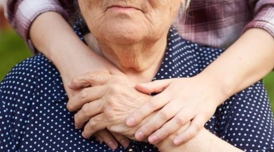 Closeup Hands Daughter Holding Her Mother S Hand Granddaughter Hugs Her Grandmother 2 E1668691508433