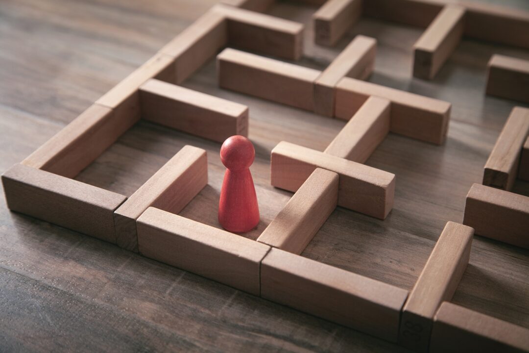 Red Human Figure Standing In The Labyrinth.
