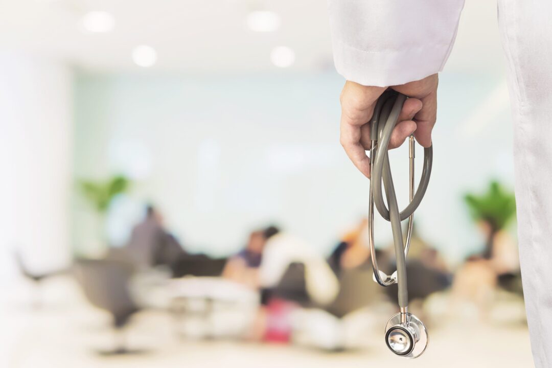 doctor-is-going-to-examine-his-patient-using-his-stethoscope-over-sitting-people-scaled