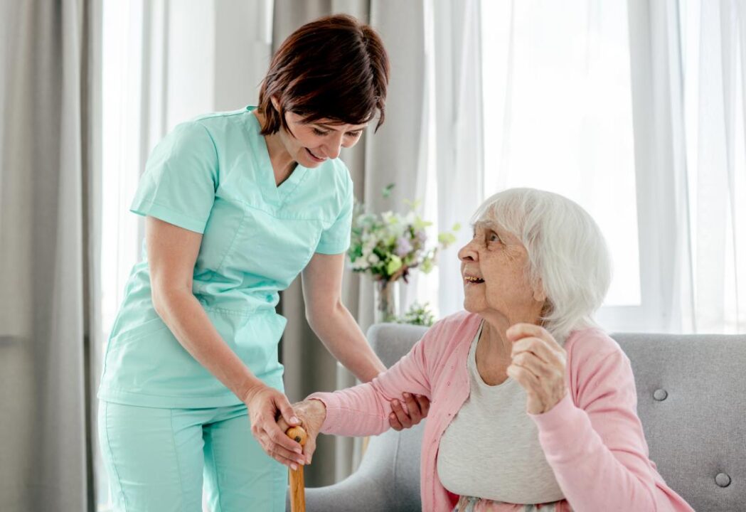 Elderly Woman Nurse Home Healthcare Worker Girl Cares About Senior Female Person Indoors 1