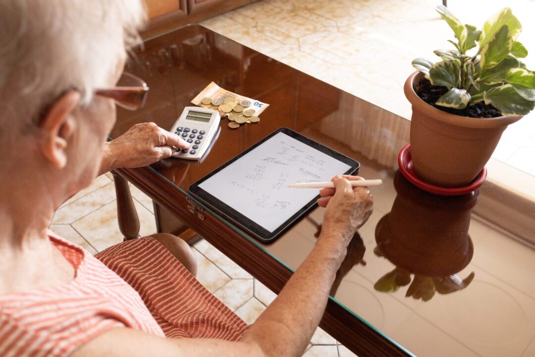 elderly-woman-with-financial-problems-at-home-due-to-economic-and-energy-crisis-and-inflation-scaled