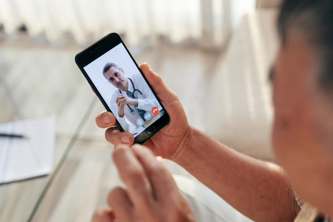 Happy Old Man Meet His Doctor Via Video Call By Smart Phone At Home While Covid 19 Out Break