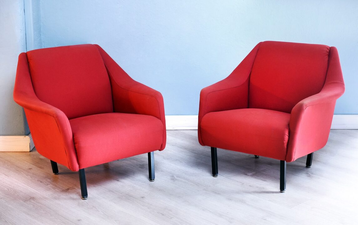 Pair Of Red Retro Arm Chairs In Living Room