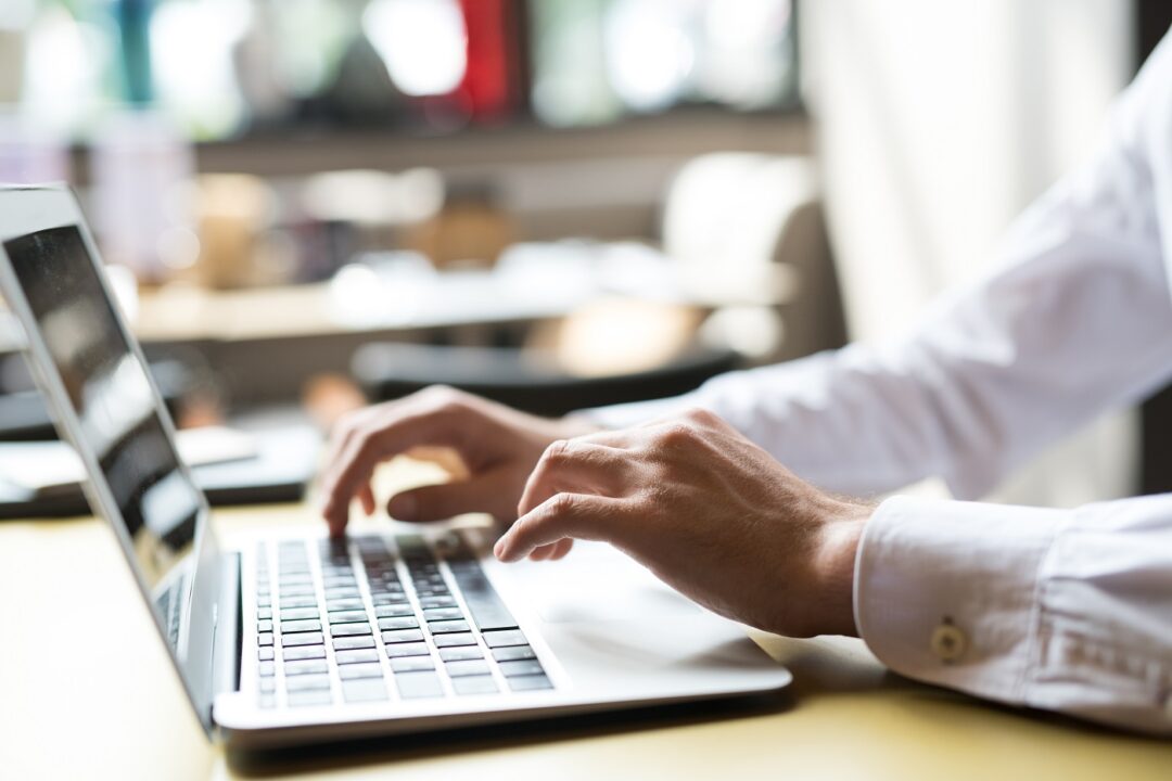 Businessman Typing On Keyboard Closeup
