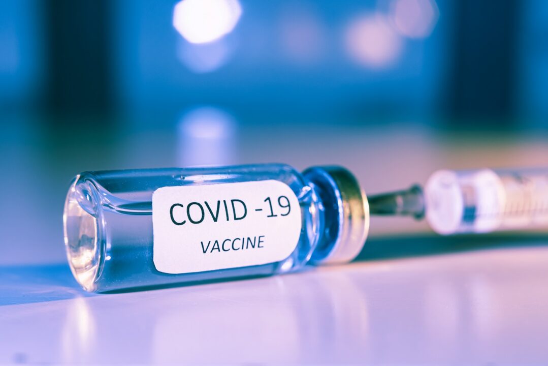 COVID 19 Coronavirus Vaccine. Ampoule And Syringe Close Up. Concept