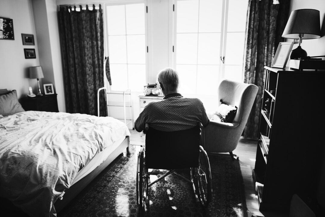 Senior Man Sitting On The Wheelchair Alone