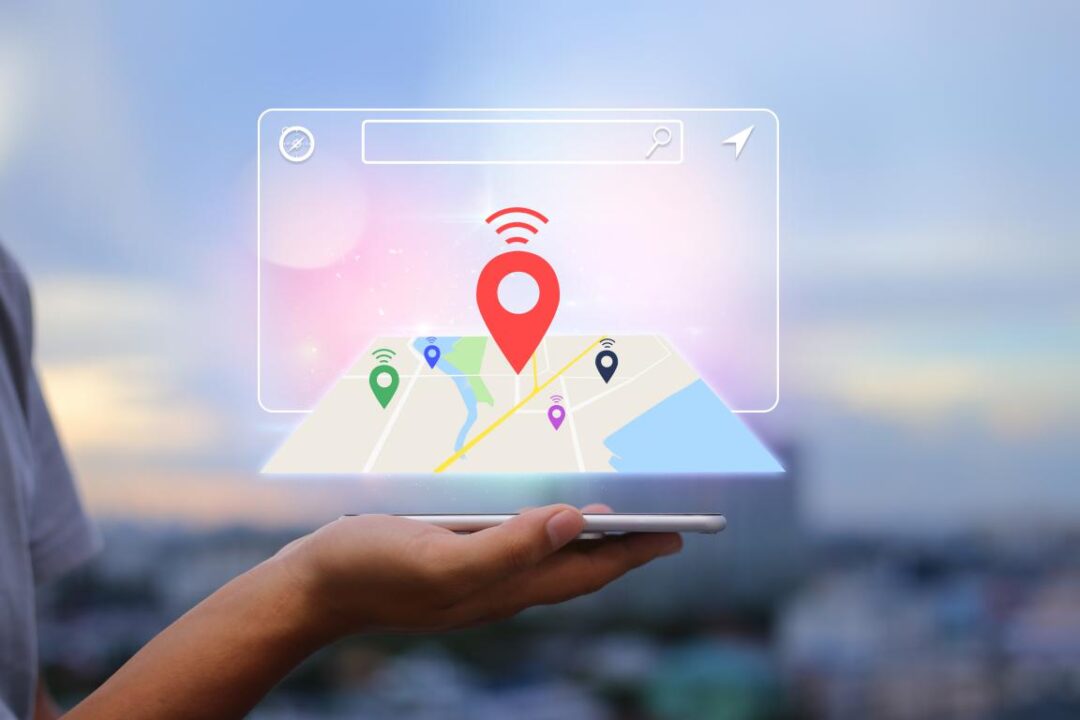 Locationnavigator Searching Business Concepthands Holding Mobile Phone Blurred City As Background