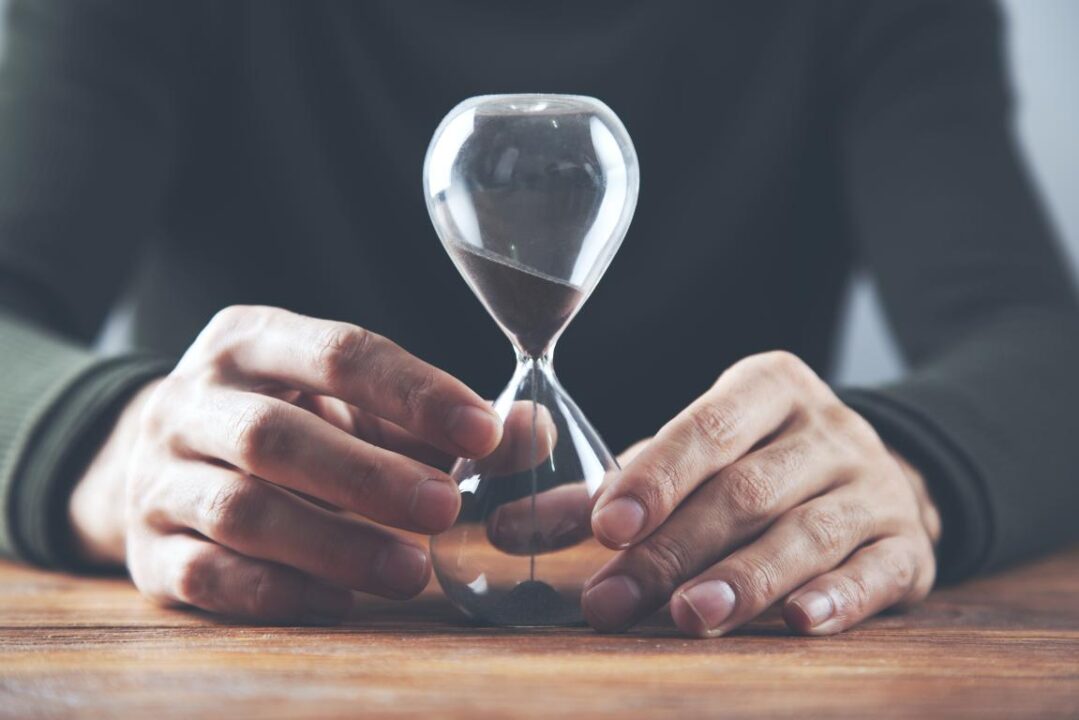 Man Hand Sand Clock 1