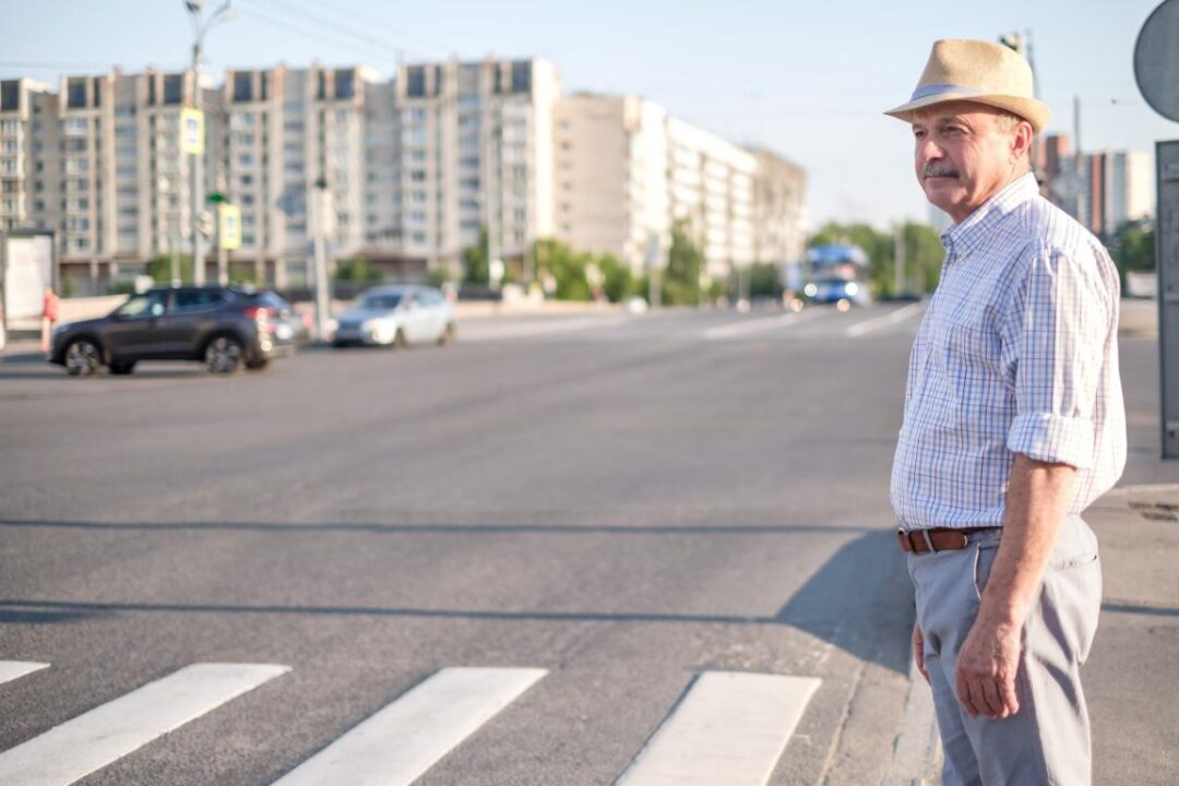 Mature European Man Waiting To Cross Street 1