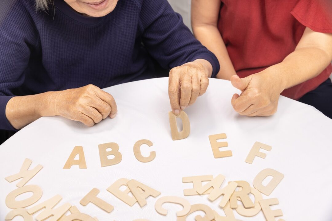 Elderly Woman Playing Alphabet Games For Improve Mental Health A