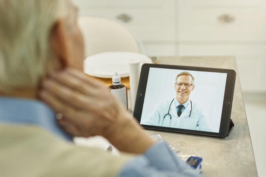 Senior Citizen Getting Hold His Physician Online 1