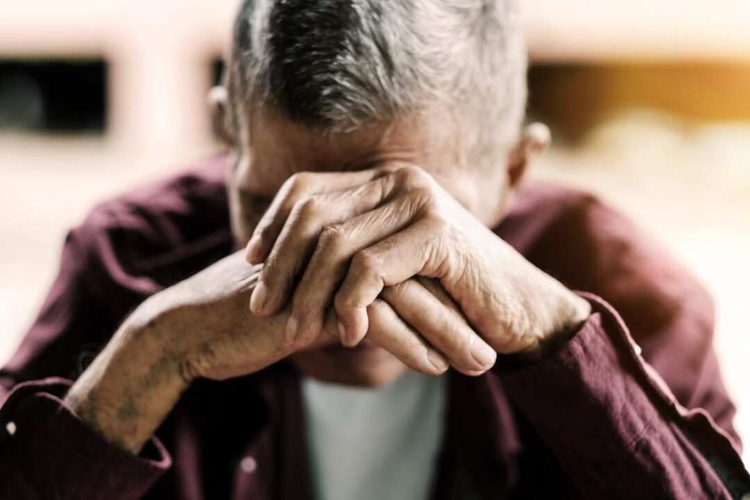 Senior Man Covering His Face With His Handsvintage Tonexa