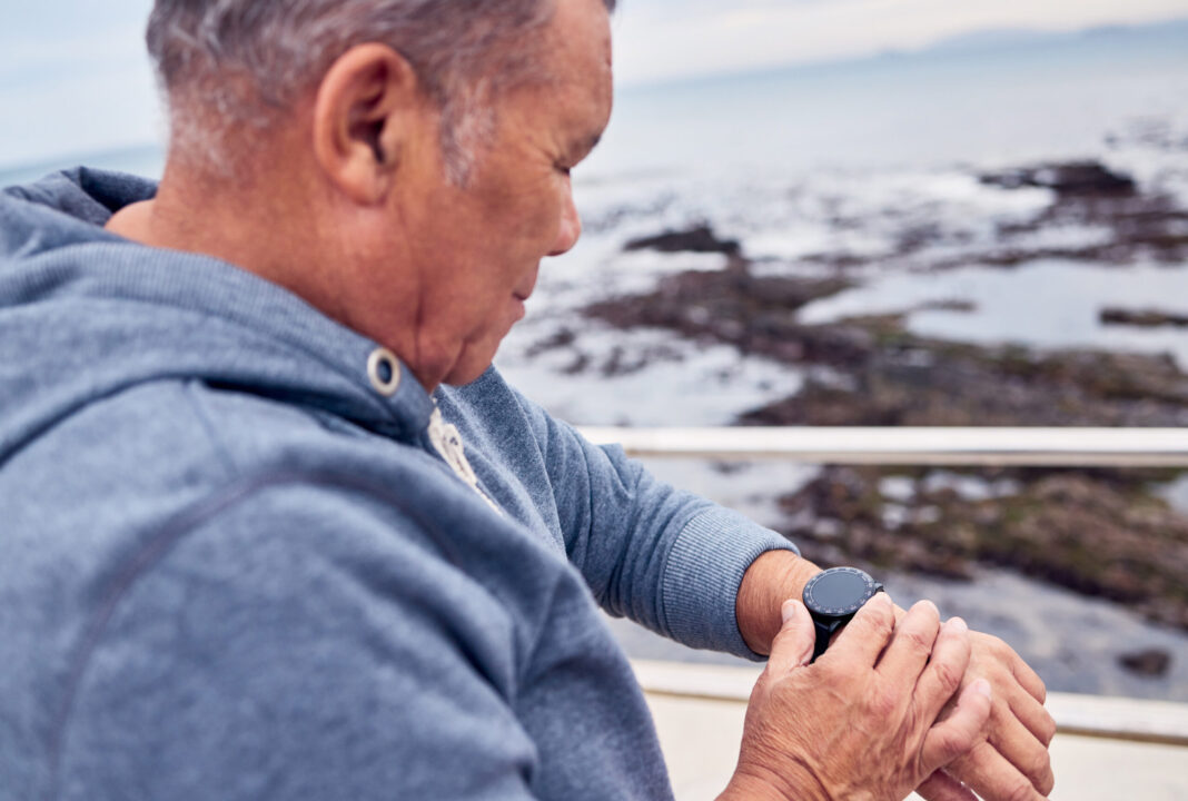 smart-watch-man-sports-exercise-beach-promenade-fitness-training-runner-wellness-stopwatch-senior-person-workout-time-heart-rate-monitor-healthy-progress-data-app-by-ocean-scaled