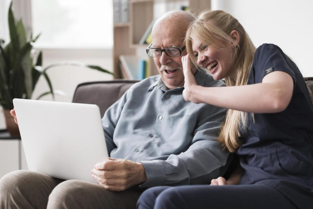 Smiley Old Man And Nurse Having A Video Call On Laptop 1