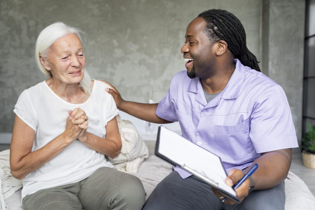 social-worker-taking-care-of-an-old-woman-scaled