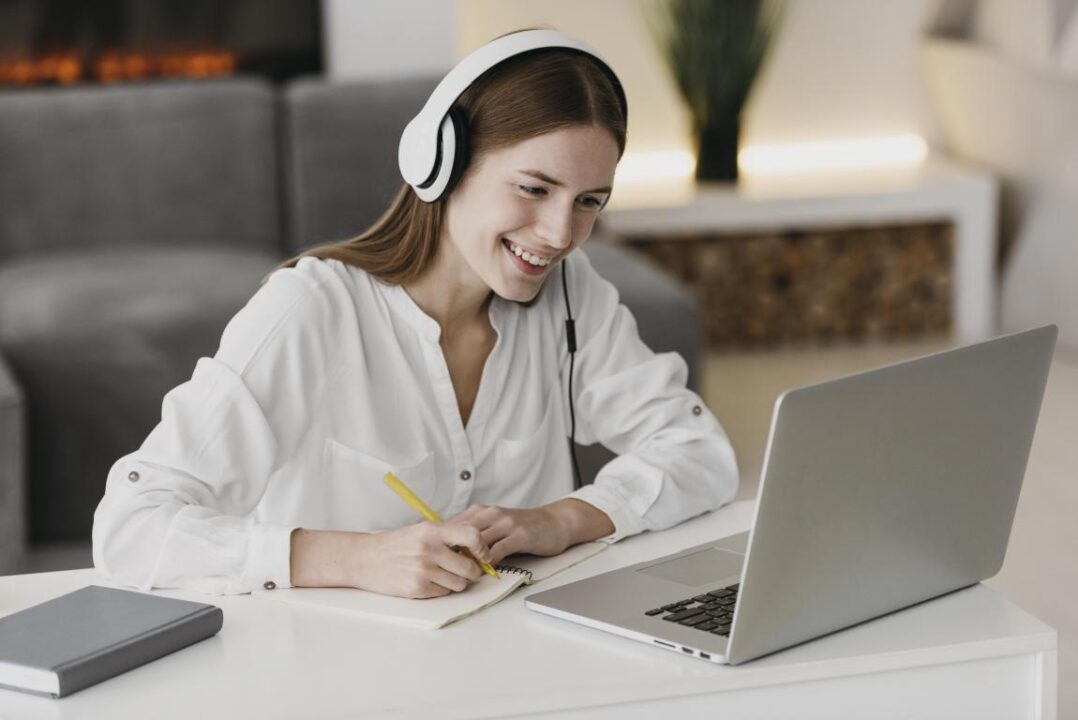 Teacher Talking With Her Students Online