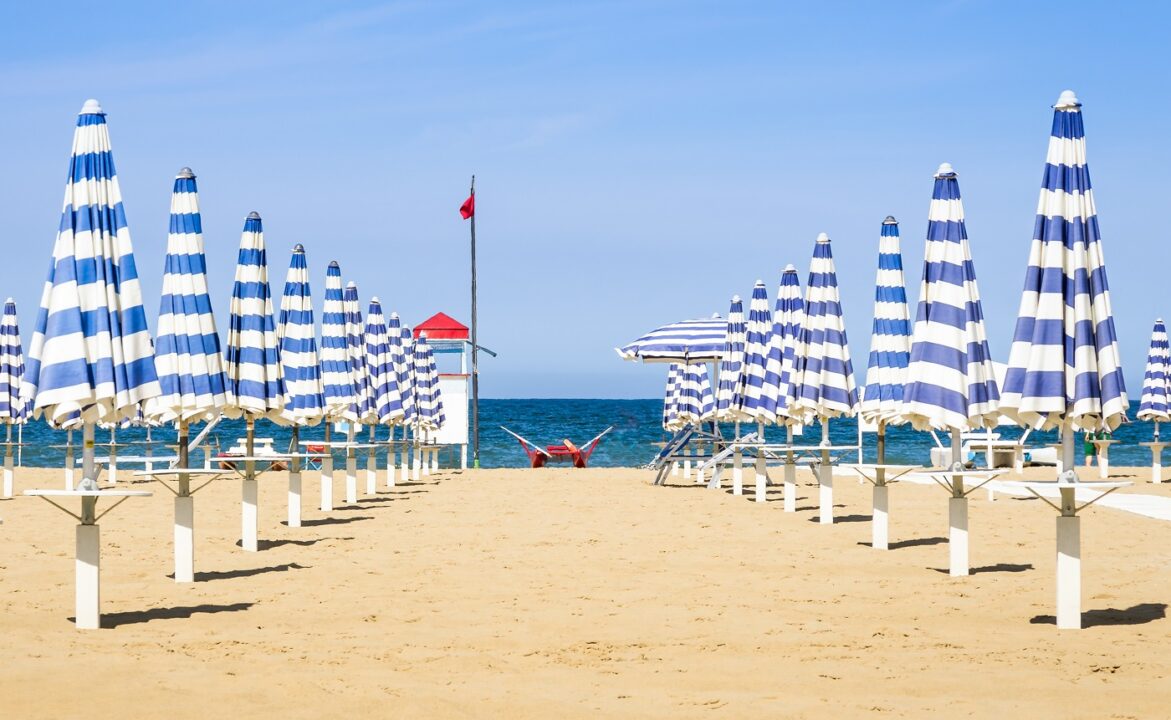 Umbrellas And Rescue Station At Rimini Beach Italian Summer