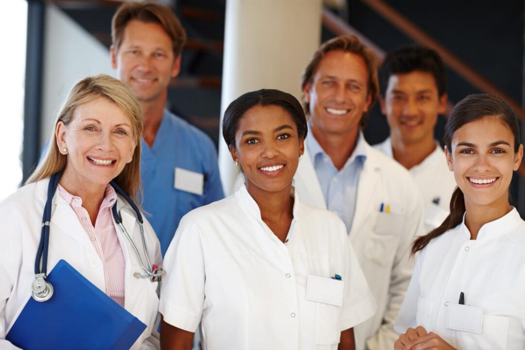 We Never Fail Deliver Shot Group Medical Professionals Smiling Camera