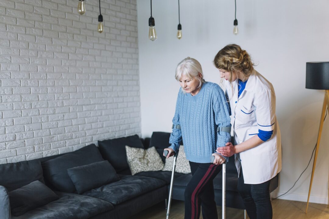 woman-walking-in-retirement-home-scaled